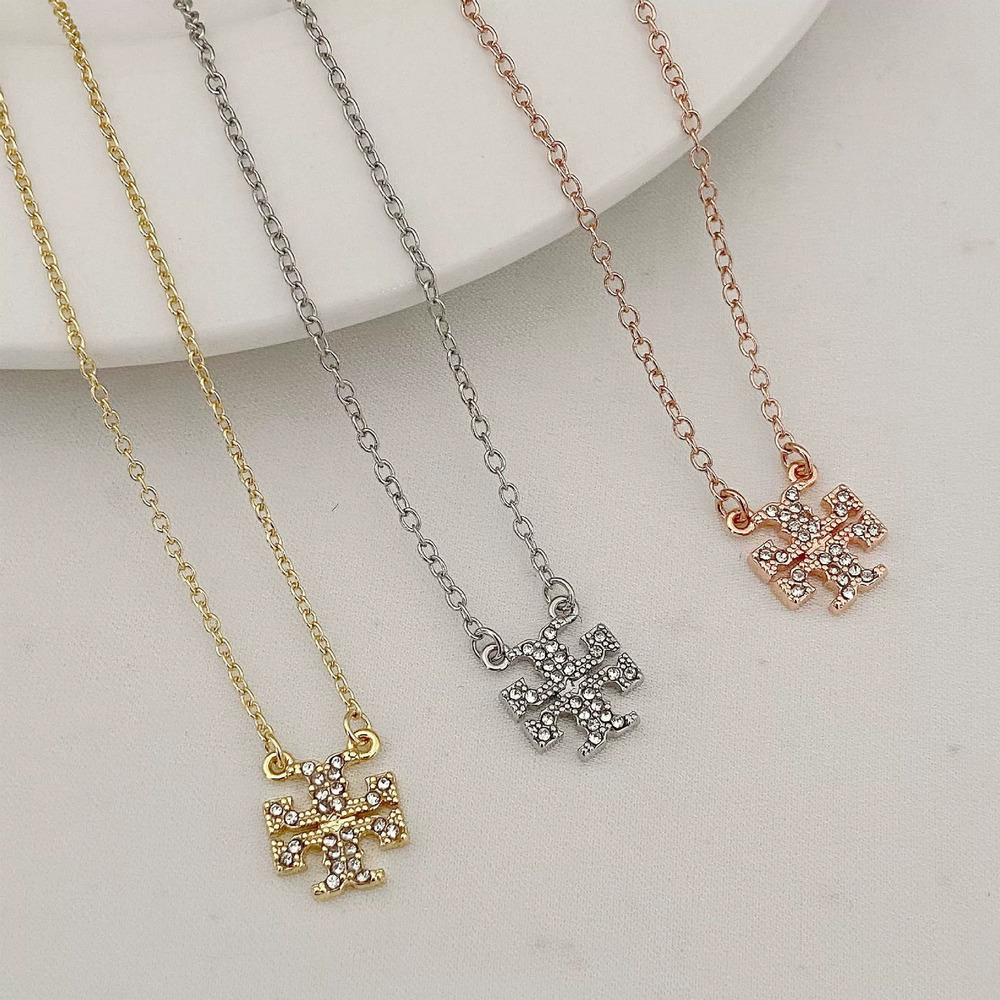 Tory Burch and necklace with full diamond setting and double T logo, plated in